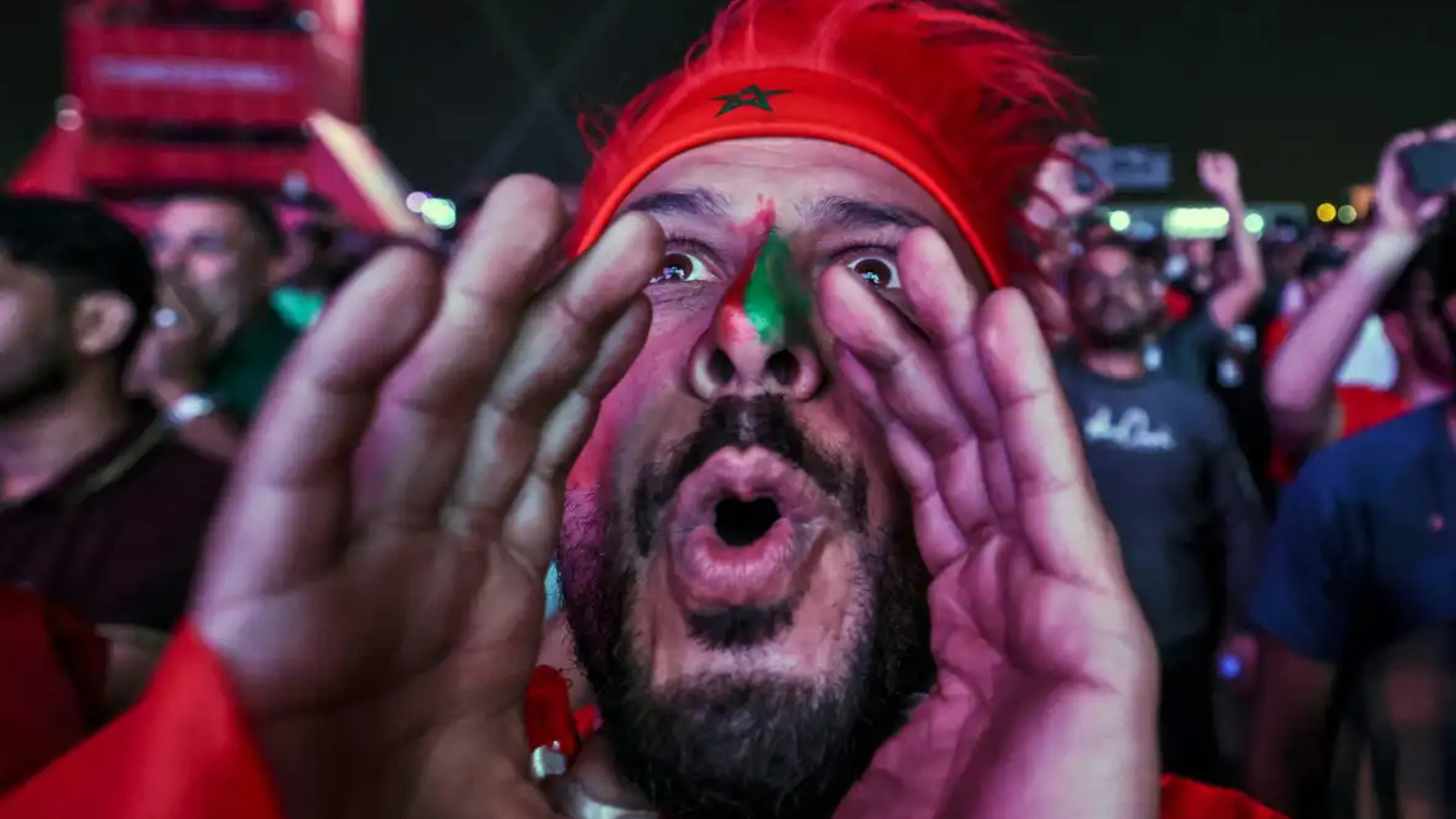 Morocco supporters celebrate at the FIFA fan zone in Doha after beating Spain, December 2022