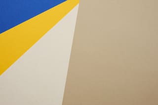 Blue, yellow and beige paper shapes