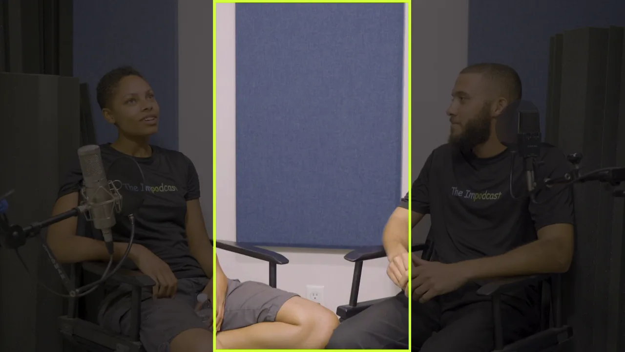 A wide two-shot from The Impodcast: two hosts in chairs at microphones. A bright box marks the middle third of the frame, which falls on the empty wall between them.